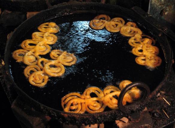 Jalebi frying in a wok